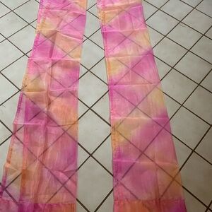 Pink and Orange Sheer curtain panels.